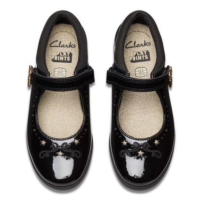 Front angle view of black patent leather Clarks Kids Lock Magic school shoes with riptape strap and key detail design on a neutral studio background.