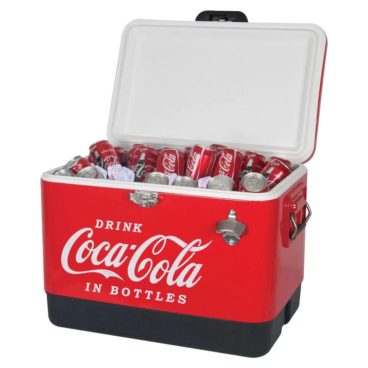 Red vintage style Coca-Cola 51L stainless steel ice chest cooler with built-in bottle opener standing on a rustic wooden patio table during an outdoor gathering.
