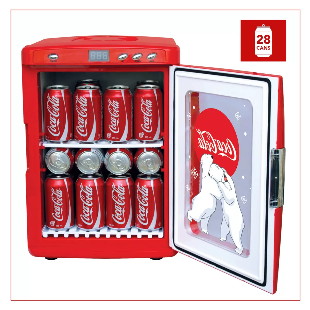 Vibrant red Coca-Cola 25L mini fridge with polar bear graphics and chrome handles, glowing with LED interior light through its tempered glass door on a sleek desk.