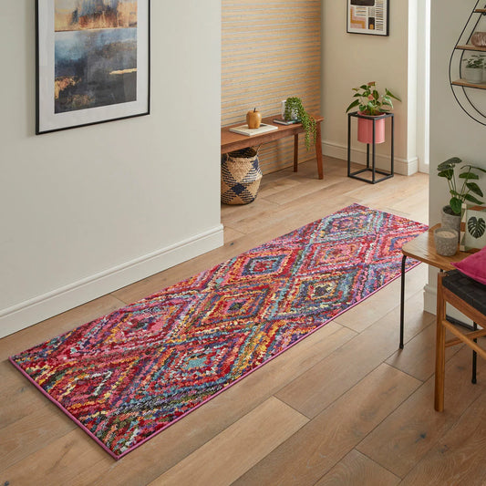 Concept Looms Carnaval Pink Runner with a bold geometric pattern displayed in a brightly lit UK home hallway.