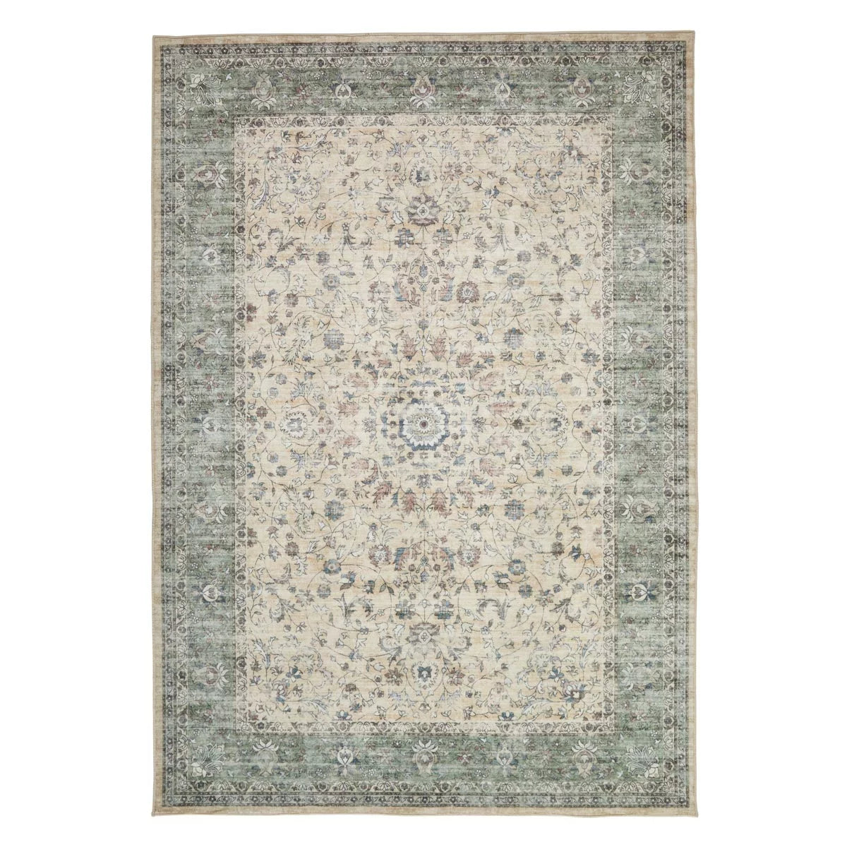 Angle view of the cream and green floral Concept Looms Liberty Washable Rug showing its plush velvet texture and short 4mm pile on a dark laminate floor.
