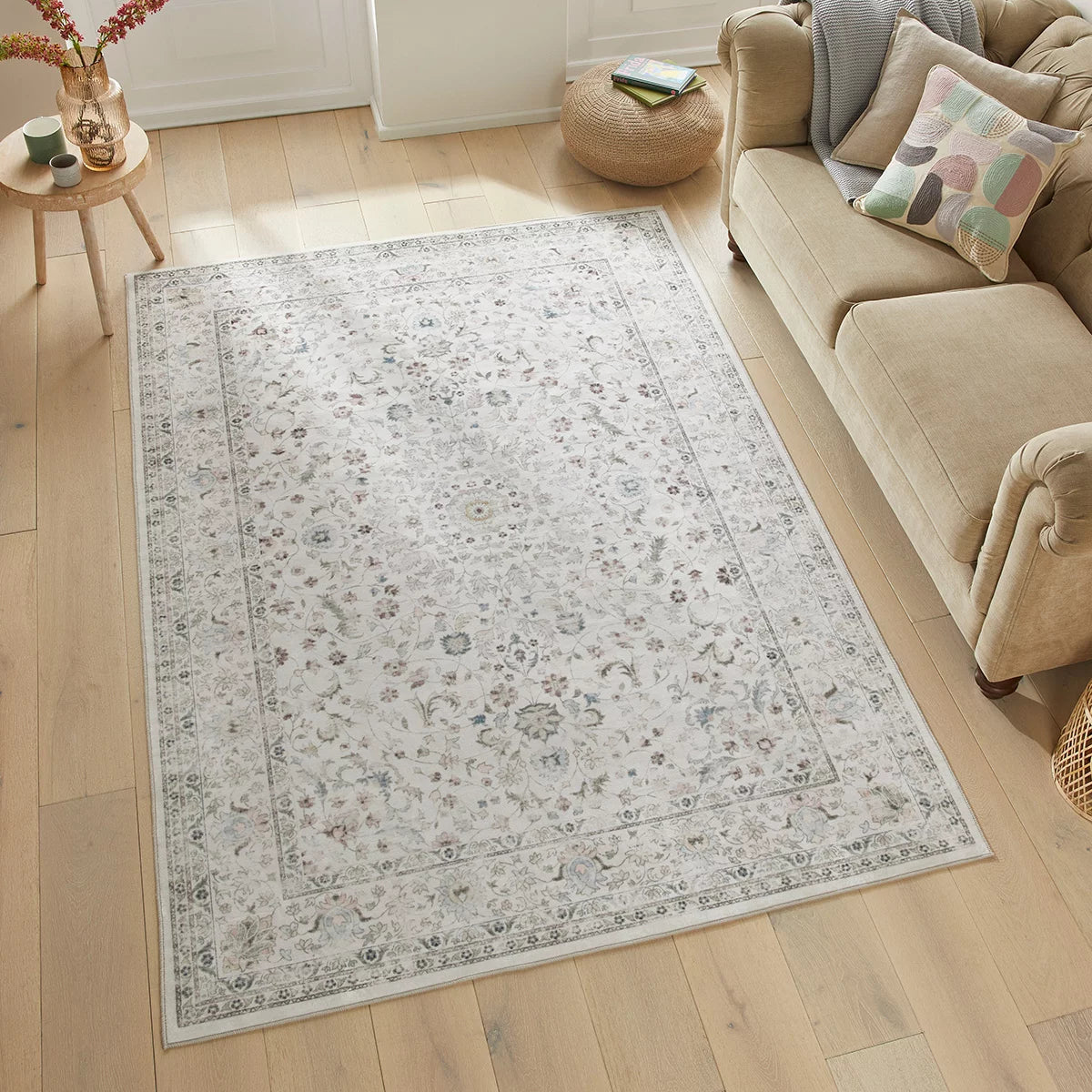 Flat-lay angle of the cream Concept Looms Liberty Washable Rug resting on a dark wood floor showing its soft 4mm velvet surface and finished edges.