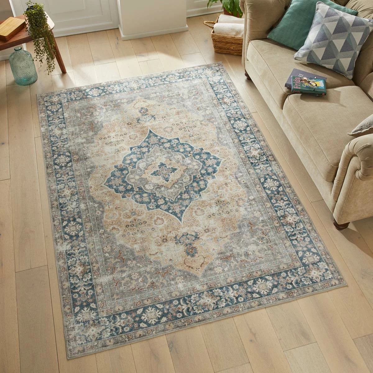 Close-up angle of the gold-patterned Concept Looms Liberty Washable Rug resting flat on a modern wood floor showing its soft 4mm velvet surface.