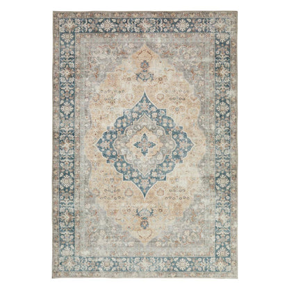 Close-up angle of the gold-patterned Concept Looms Liberty Washable Rug resting flat on a modern wood floor showing its soft 4mm velvet surface.