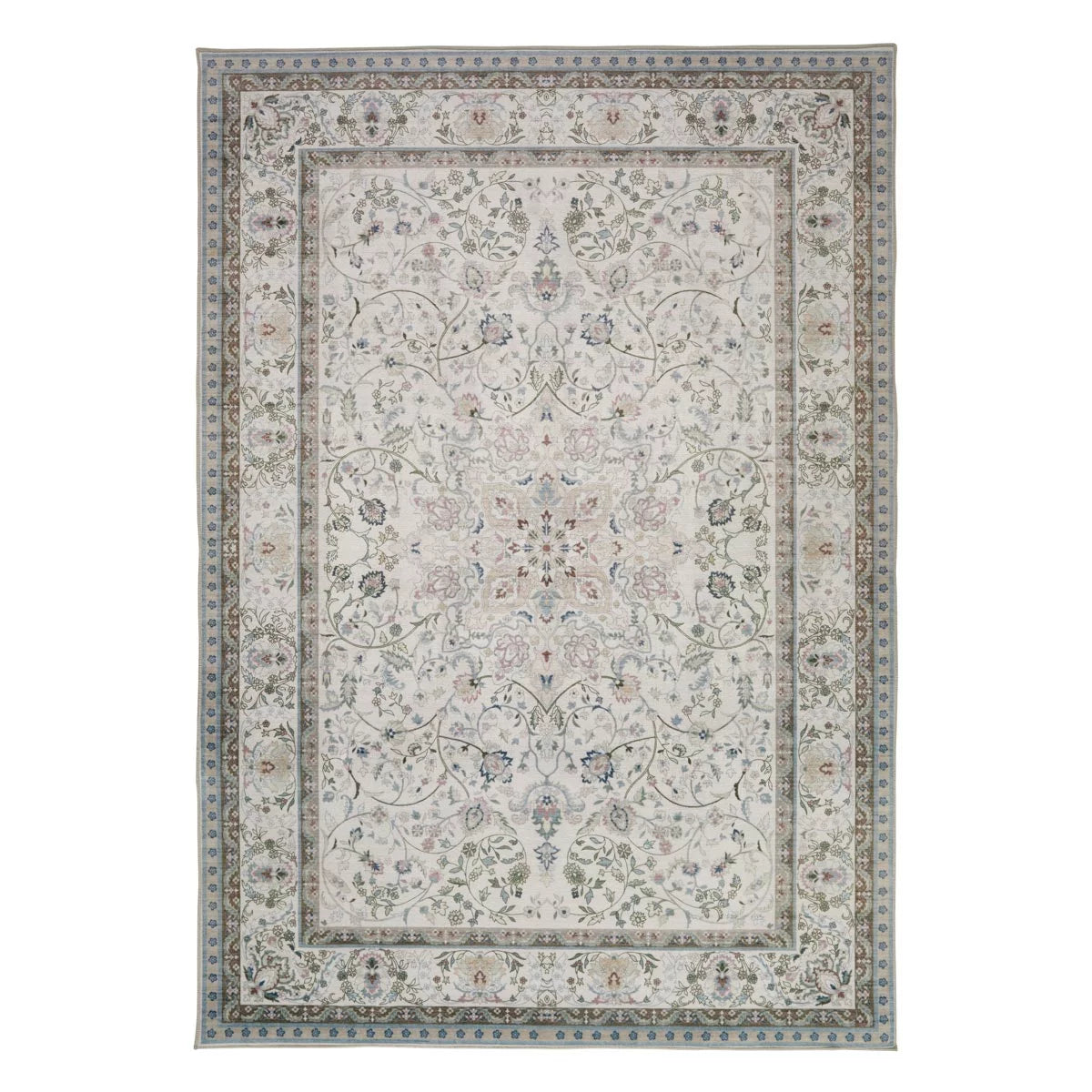 Top-down view of the soft pastel pink and grey Concept Looms Liberty Washable Rug resting smoothly on a light hardwood floor next to a modern sofa.
