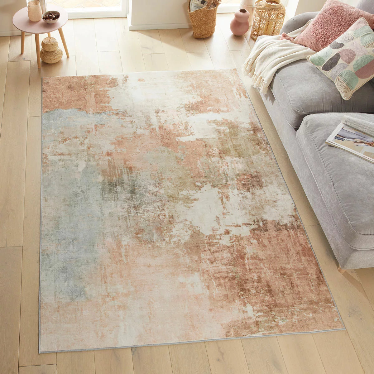 Top-angle view of the plush Concept Looms Liberty Spring Washable Rug laid out on a polished hardwood floor in a brightly lit modern living room setting.