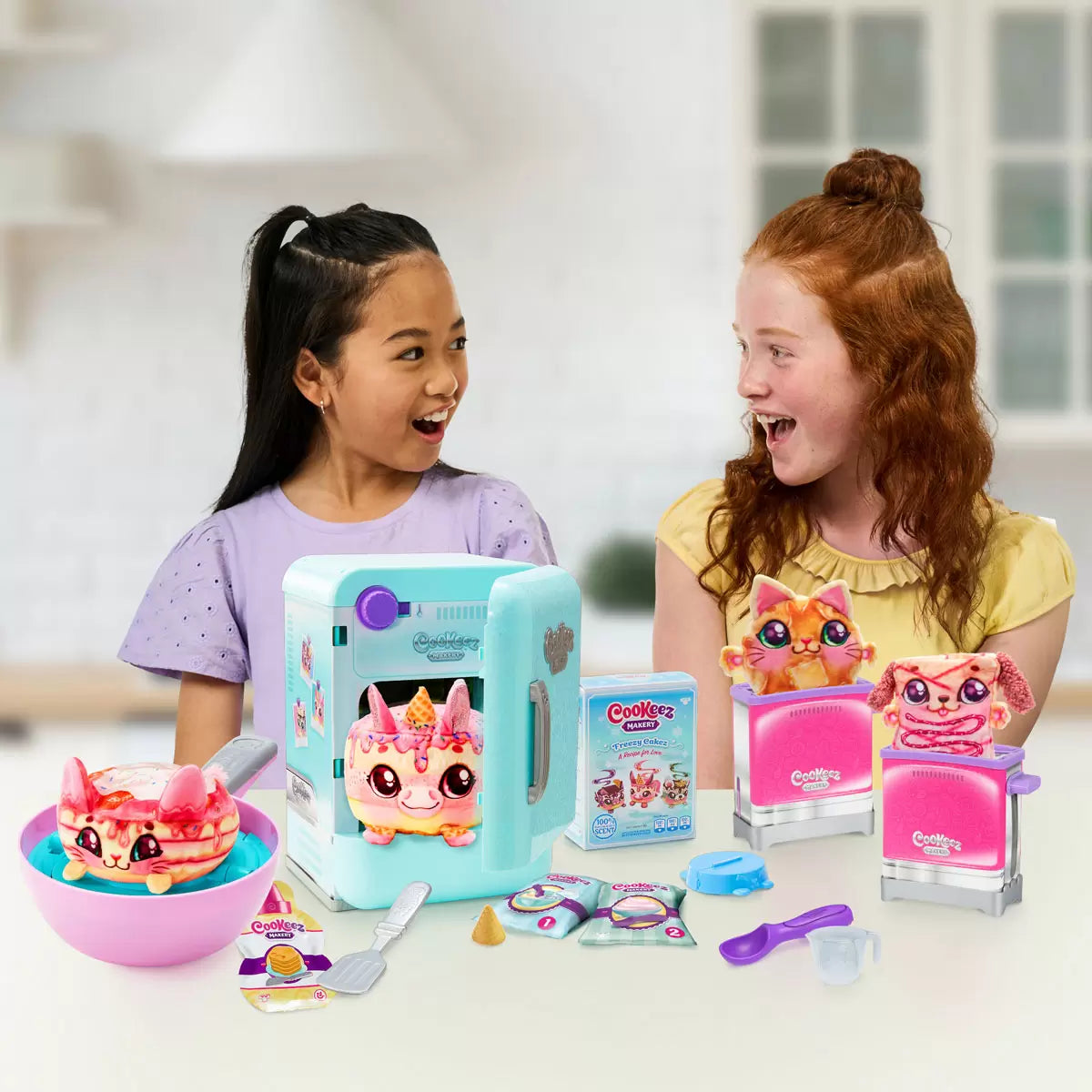 Front view of the Cookeez Makery Role-Play Bulk Set packaging displaying four colorful kitchen playsets, accessories, and four scented plush toys.