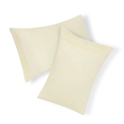 Panda Signature+ cream bamboo lyocell bedding set draped on a mattress showing silky satin texture, fitted sheet, duvet cover, and pillowcases.
