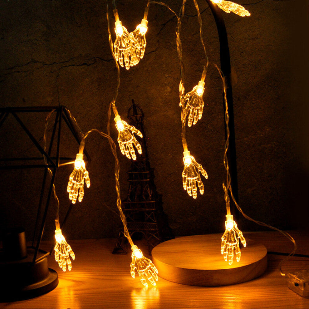 A 2-meter string of crystal skull LED lights glowing with a crisp 5500K light along a dark indoor mantelpiece.