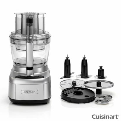 Front angle view of the silver Cuisinart FP1300SU Expert Prep Pro Food Processor set up with its 3L bowl and blade accessories on a clean kitchen counter.