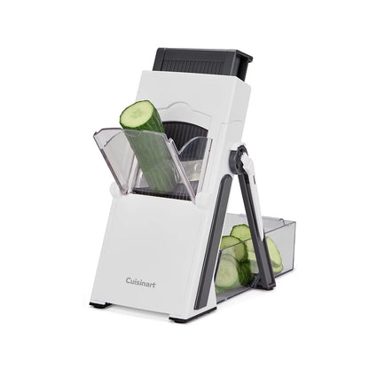 The Cuisinart PrecisionSlice Upright Mandoline standing on a counter, showcasing its extra-wide feed tube, control knob, and attached clear collection container.