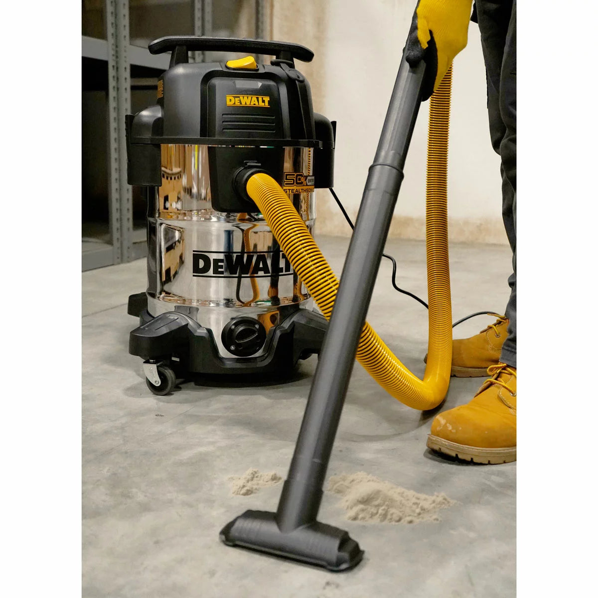 DEWALT 38 litre wet and dry corded vacuum cleaner with 2.1m hose for heavy-duty workshop and industrial cleaning.