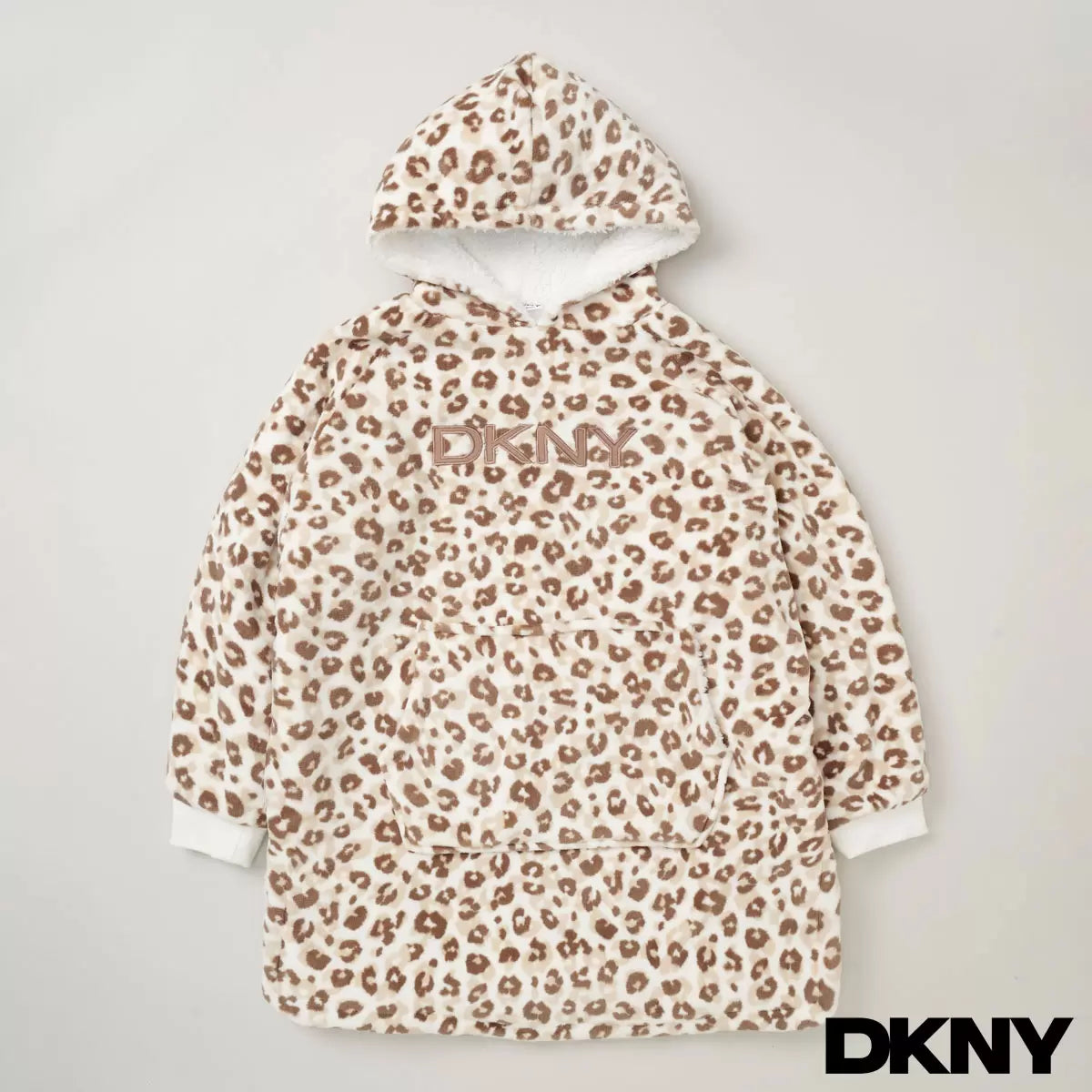 Front view of a plush black DKNY kids oversized hoodie displaying the fluffy sherpa fleece interior lining and front kangaroo pocket on a clean neutral background.