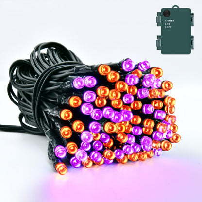 Dalugo 5-metre orange and purple Halloween fairy lights wrapped around a dark wooden porch railing with a waterproof battery box.