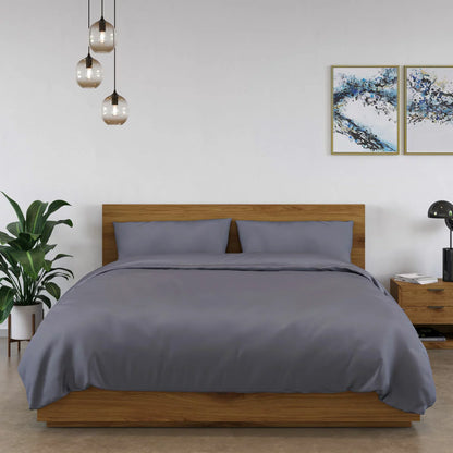 Panda 100% bamboo dark grey duvet cover set spread on a bed showing silk-soft texture, natural bamboo buttons, and matching pillowcases.