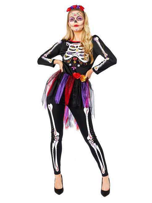 Adult wearing a black and red Day of the Dead costume featuring skull prints and red floral accents.