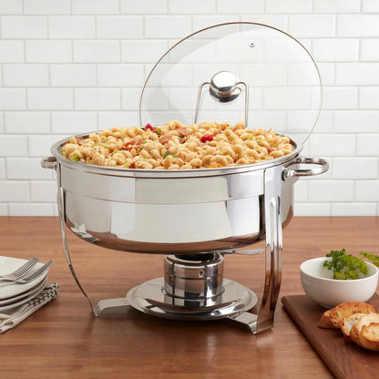 Denmark 8.5-litre round polished stainless steel chafing dish with clear glass lid on a set dining table view.
