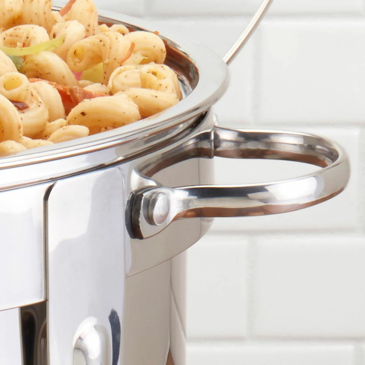 Denmark 8.5-litre round polished stainless steel chafing dish with clear glass lid on a set dining table view.