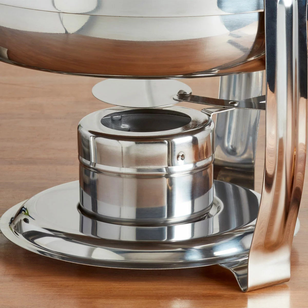Denmark 8.5-litre round polished stainless steel chafing dish with clear glass lid on a set dining table view.