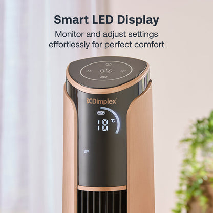 A tall, slender black and copper Dimplex Ion Fresh tower fan standing elegantly on a hardwood floor next to a modern armchair.