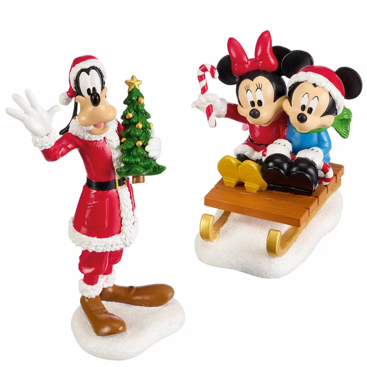 Complete 13-piece lighted Disney Christmas village featuring hand-painted Mickey Mouse figures, glowing LED snow-covered houses, and illuminated archway on a wooden table.