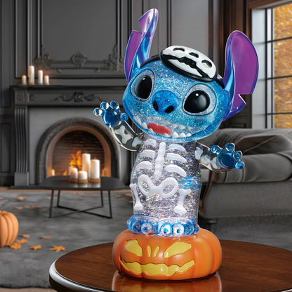 A 16-inch black Disney Halloween lantern displaying intricate character sculptures inside a liquid-filled chamber with glowing orange LED lights and swirling gold glitter sparkles, captured from a front eye-level perspective.