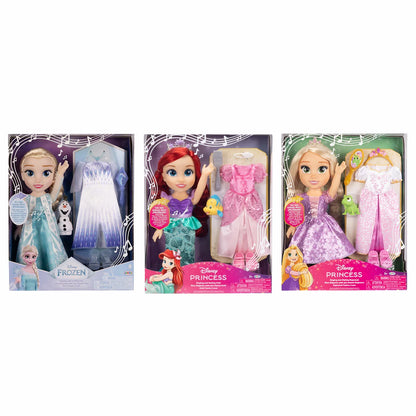 Front view of a Disney My Singing and Styling doll wearing a detailed princess gown with an extra outfit, tiara, and hairbrush laid out on a clean backdrop.