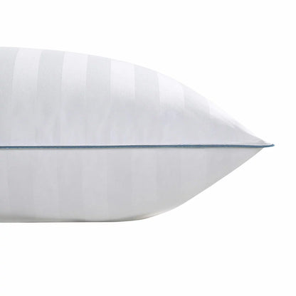 Crisp white Down Haven king size duck down pillow featuring a subtle striped 500 thread count cotton cover resting on a neatly dressed king bed.