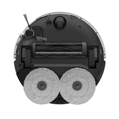 Front angle view of the sleek black Dreame X40 Ultra Complete robot vacuum parked inside its tall self-cleaning dock on a polished hardwood floor.
