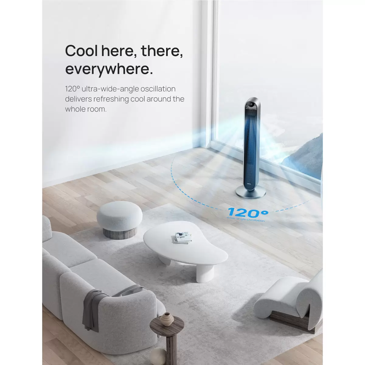 Silver Dreo Pilot Max DR-HTF004S smart tower fan standing upright on a dark hardwood floor against a minimalist white living room wall.