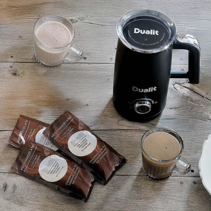Dualit Milk Frother & Hot Chocolate Maker Max with Belgian chocolate sachets making creamy café-style hot drinks.