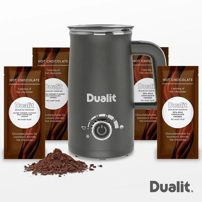 Front view of the grey Dualit Milk Frother Max displaying the froth adjustment dial, non-drip spout, and cool-touch body on a modern kitchen countertop.