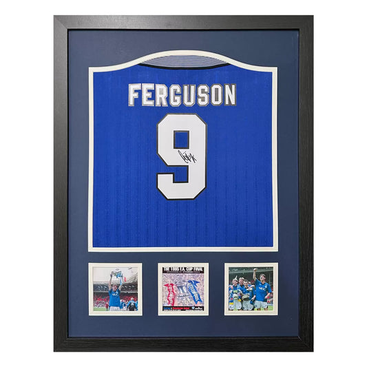 A professionally framed retro 1995 Everton football shirt signed on the number nine by Duncan Ferguson, displayed in a large wooden frame against a neutral background.