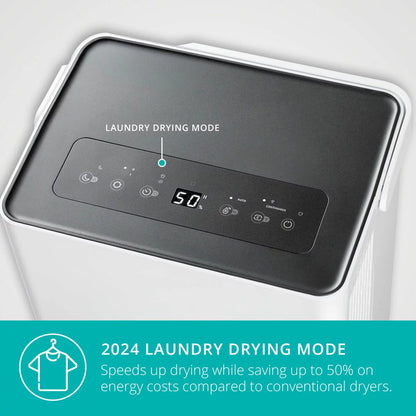 A white upright Duux Bora Smart 30L Dehumidifier showing its sleek integrated caster wheels and ambient casing display within a modern, sunlit laundry room.
