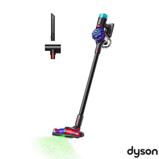 Front view of the Dyson V10 Konical Cordless Stick Vacuum displaying the illuminated floor head resting on a wooden floor.