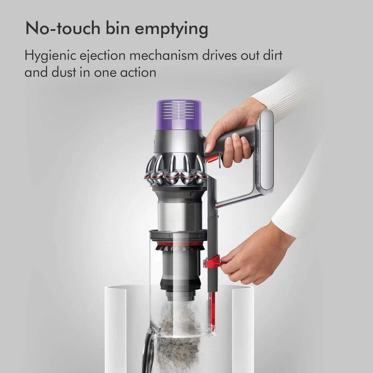 Profile view of the nickel and copper Dyson V10 Submarine cordless wet and dry vacuum cleaner upright on its wall dock with the Submarine wet roller attached.