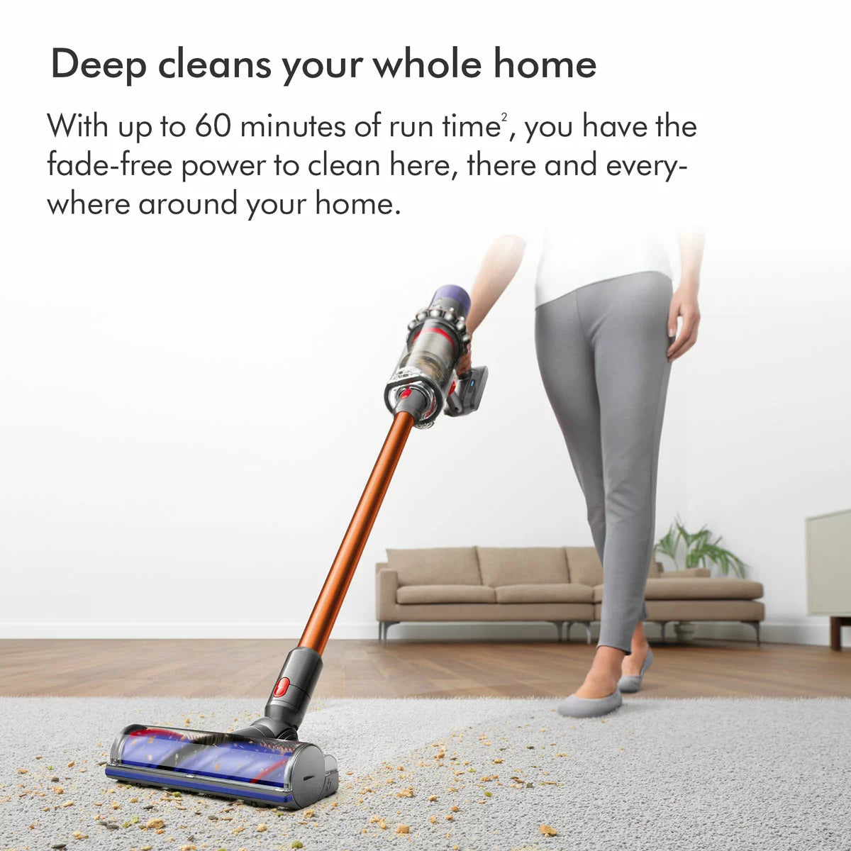 Profile view of the nickel and copper Dyson V10 Submarine cordless wet and dry vacuum cleaner upright on its wall dock with the Submarine wet roller attached.