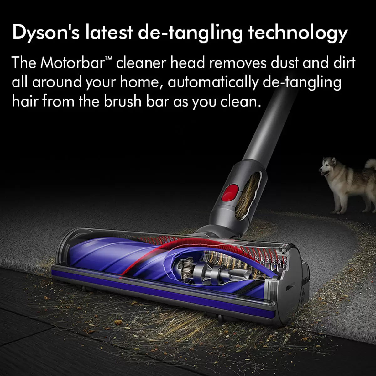 Side profile of the nickel and iron Dyson V8 Advanced cordless stick vacuum cleaner mounted upright on a neutral modern wall dock.