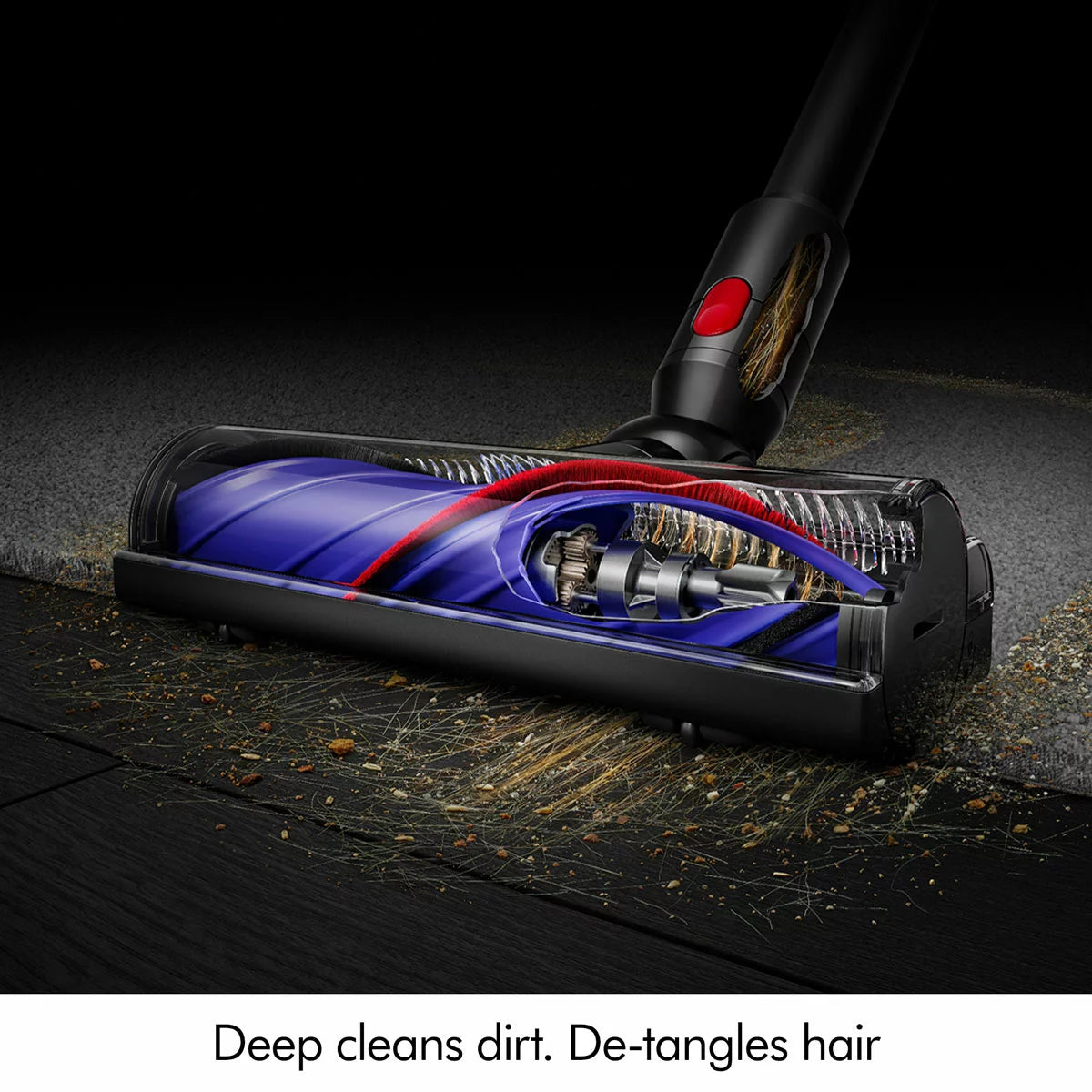 Dyson V8 Cyclone stick vacuum cleaner in use on carpet, removing pet hair and dust with powerful cordless suction technology.