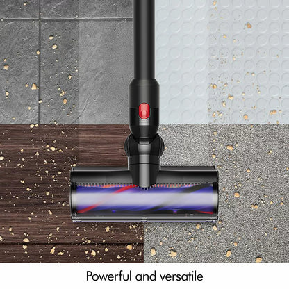 Side angle view of the nickel and purple Dyson V8 Cyclone stick vacuum mounted in its wall dock on a plain wall setup.