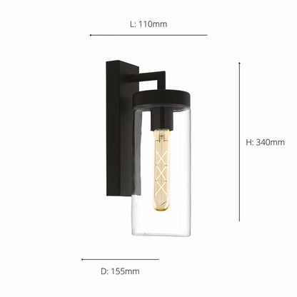 EGLO Bovolone exterior wall lamp in a matte black finish, featuring a clear cylindrical glass shade mounted on an outdoor wall at dusk.