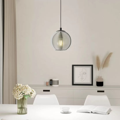 Eglo Ariscani 1 smoked glass ball pendant light hanging from ceiling in a modern interior setting