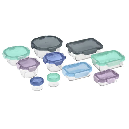 Top-down view of the 20-piece Ello Colour Lock glass food storage set arranged on a clean quartz kitchen countertop featuring clear glass bases and colorful airtight snap lids.