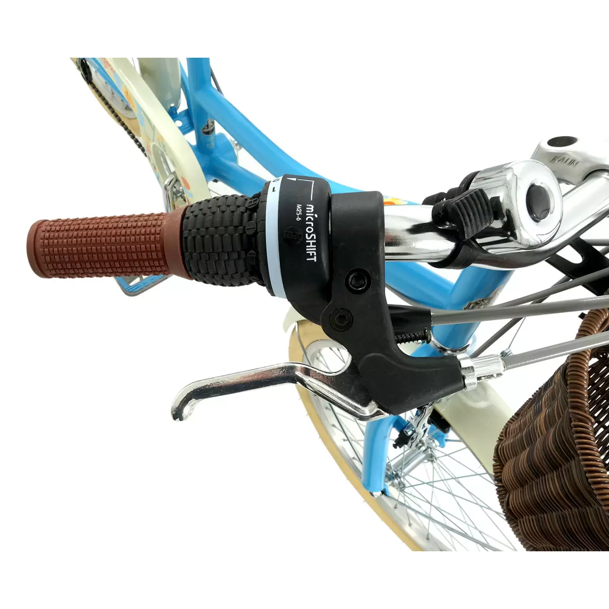 Side profile of the satin Hawaiian blue Elswick Cherish 20-inch kids heritage bike showing the front wicker basket, cream tires, and brown leather-effect saddle on a paved path.