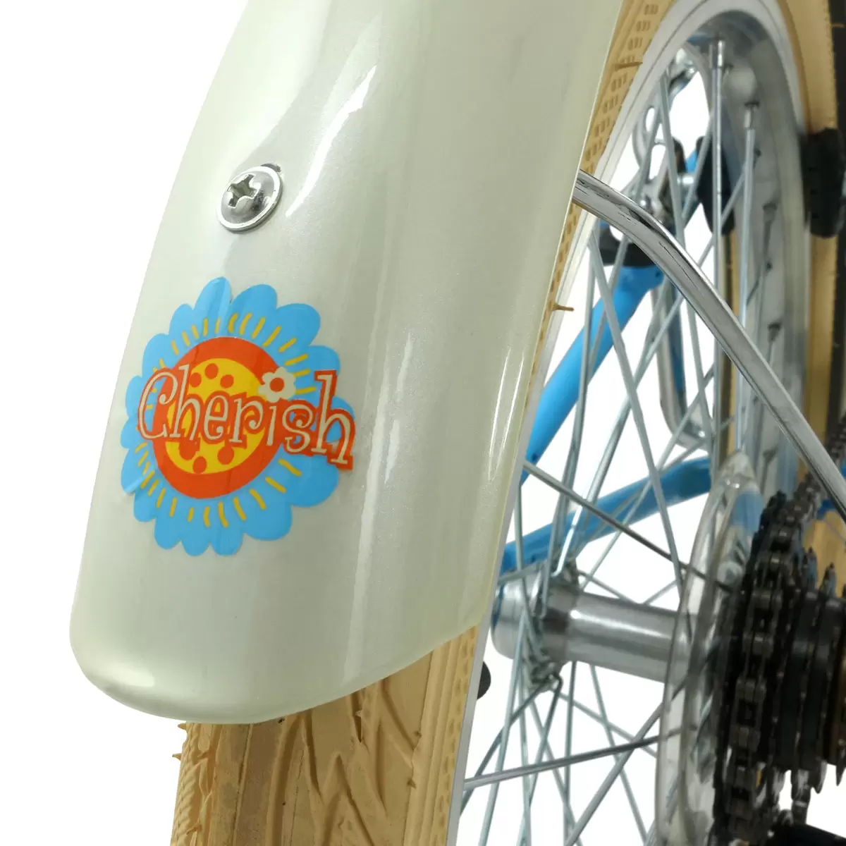 Side profile of the satin Hawaiian blue Elswick Cherish 20-inch kids heritage bike showing the front wicker basket, cream tires, and brown leather-effect saddle on a paved path.