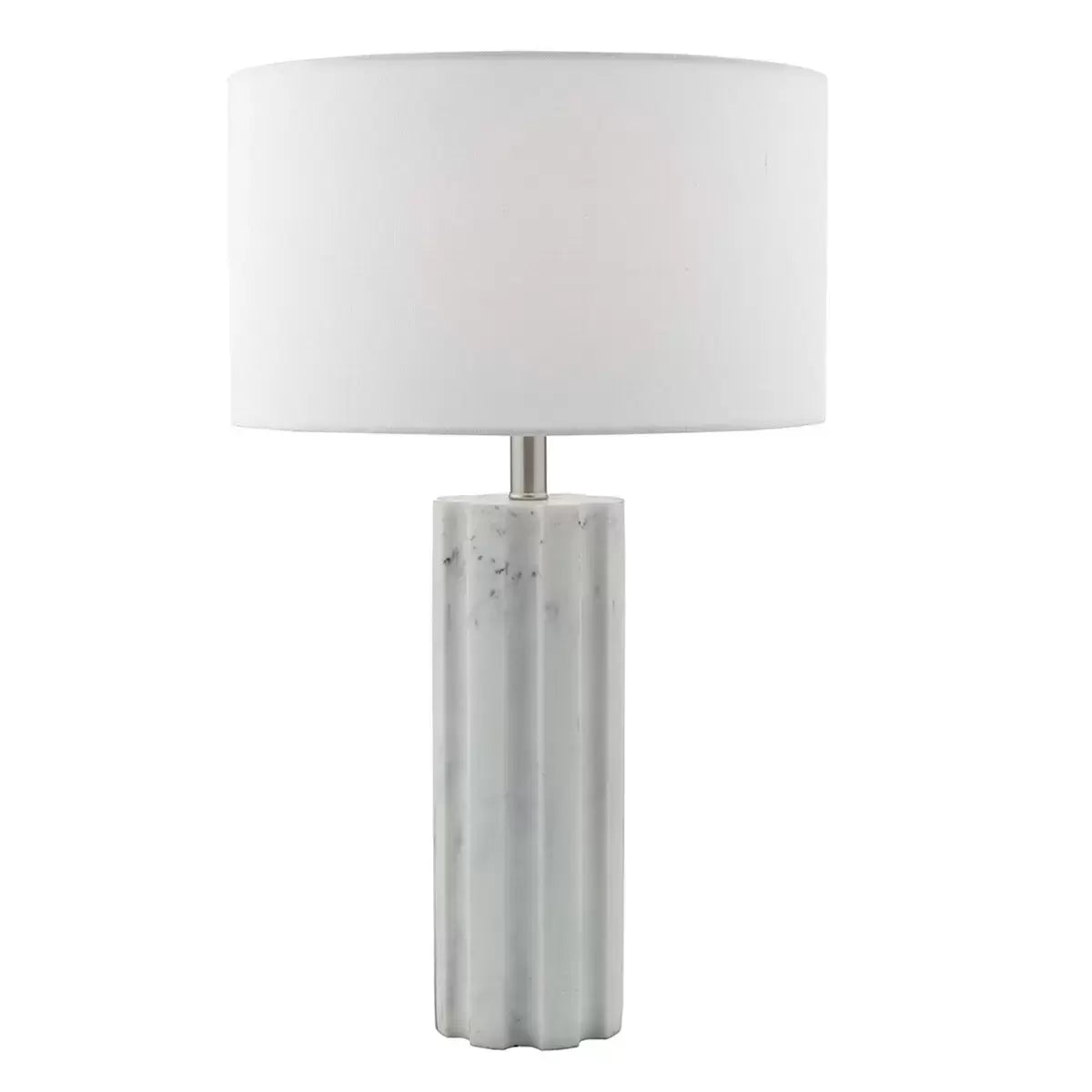 Front view of the Erebus table lamp showcasing its cylinder-shaped matte white marble effect resin base, polished chrome metal collar, and white linen drum shade on a glass desk.