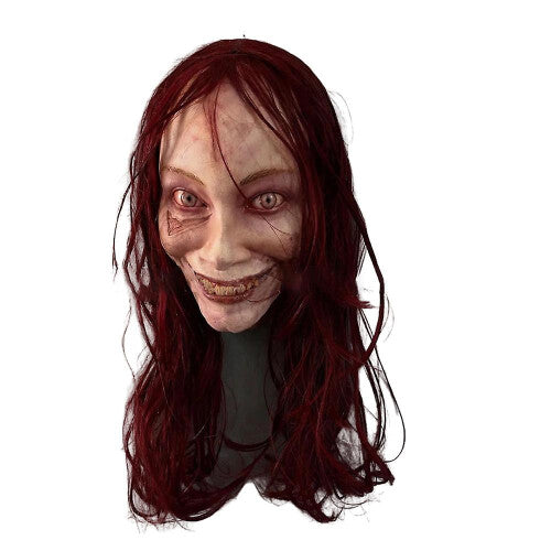 Front view of the Evil Dead Rise female ghost latex full face horror mask featuring a scary wide grin and pale possessed skin texture.