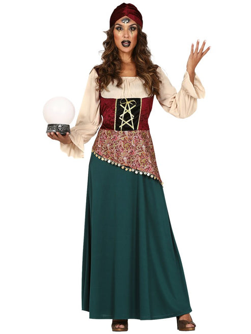 Adult wearing a mystical fortune teller costume featuring a jewel-toned dress, gold coin waist sash, and matching purple headscarf.