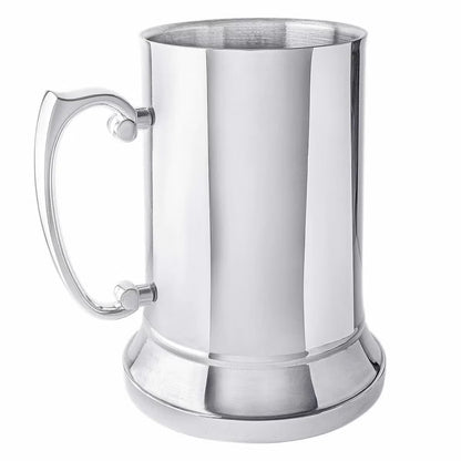 Front angle view of a silver Fred Bennett 580ml stainless steel tankard featuring a black leather wrap and a sturdy zinc alloy handle on a wooden bar desk.