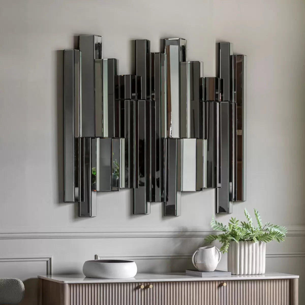 "Gallery Almada large contemporary wall mirror 110x121cm in modern minimalist bedroom reflecting natural light"
